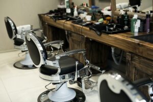 Stylish modern Barber chairs in black and grey barbershop interior